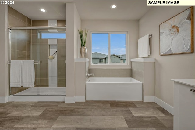 16755 SE Shimmering Leaf St, Happy Valley, OR 97086 - full bath with a garden tub, recessed lighting, baseboards, and a stall shower