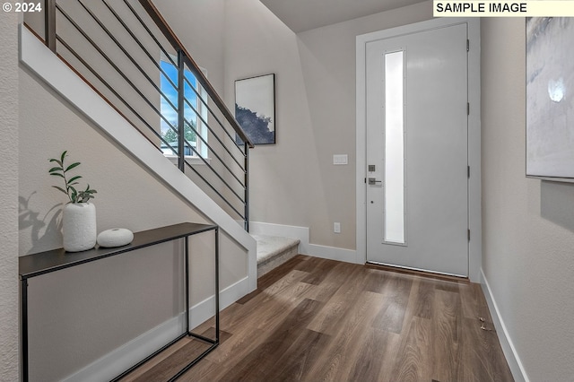 16755 SE Shimmering Leaf St, Happy Valley, OR 97086 - foyer with stairs, baseboards, and wood finished floors