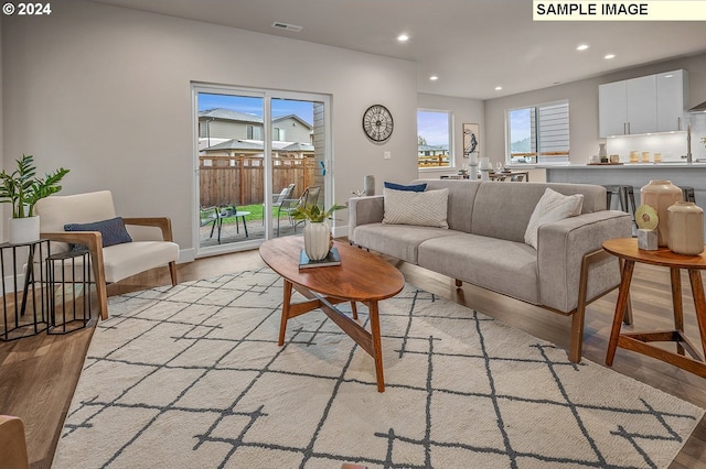 16755 SE Shimmering Leaf St, Happy Valley, OR 97086 - living room featuring recessed lighting, visible vents, and light wood finished floors