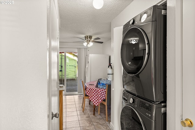 1720 17th St, Springfield, OR 97477 - laundry room with stacked washing machine and dryer, a textured ceiling, a ceiling fan, and light tile patterned flooring