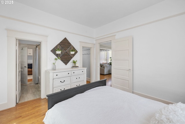 bedroom with light wood finished floors