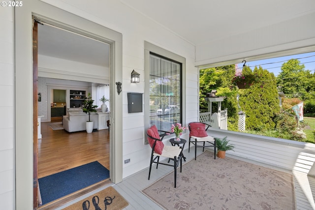 sunroom featuring wood finished floors