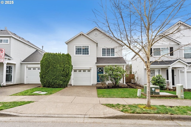 traditional-style home with concrete driveway, an attached garage, and a shingled roof