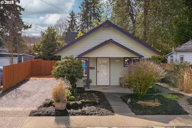 view of front of house featuring fence