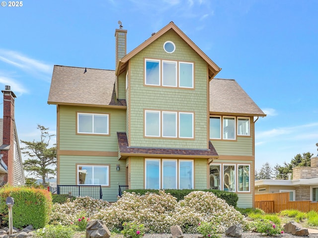 2385 Ocean Vista Dr, Seaside, OR 97138 - rear view of property featuring a shingled roof and a chimney
