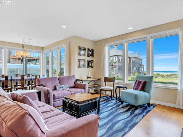 2385 Ocean Vista Dr, Seaside, OR 97138 - living room featuring a chandelier, healthy amount of natural light, baseboards, wood finished floors, and recessed lighting