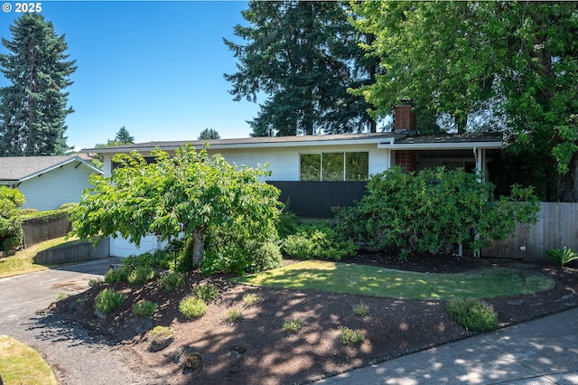 13530 NE Milton St, Portland, OR 97230 - view of front of house featuring a chimney and concrete driveway