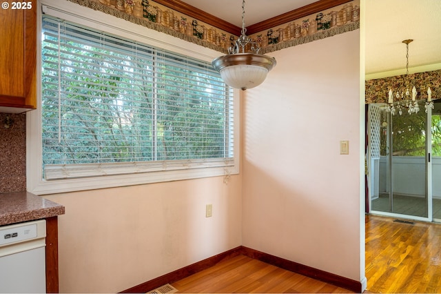 13530 NE Milton St, Portland, OR 97230 - unfurnished dining area featuring wood finished floors and a chandelier