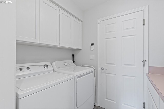 laundry area with cabinets and washer and dryer