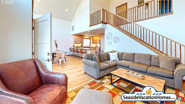 1560 S Edgewood St, Seaside, OR 97138 - living area with light wood finished floors, high vaulted ceiling, recessed lighting, and stairway