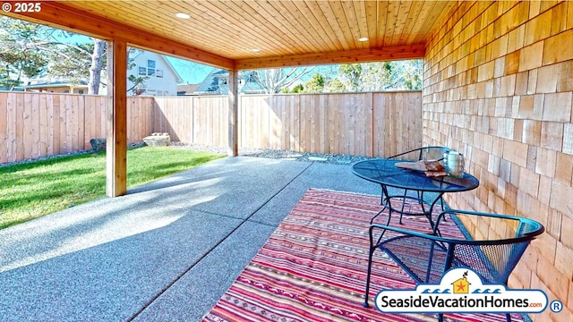 1560 S Edgewood St, Seaside, OR 97138 - fenced backyard with a patio area