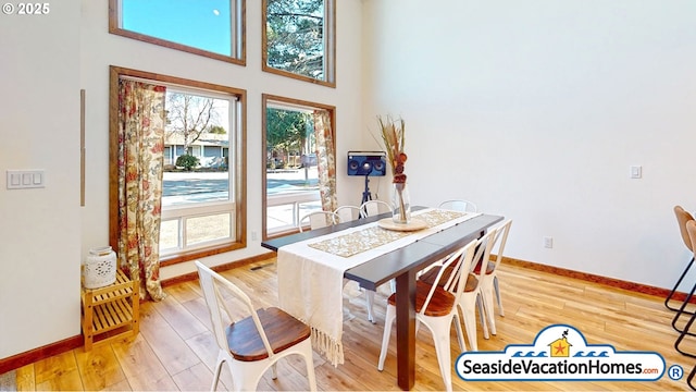 1560 S Edgewood St, Seaside, OR 97138 - dining space featuring light wood finished floors, healthy amount of natural light, and a high ceiling