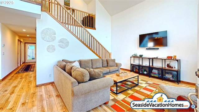1560 S Edgewood St, Seaside, OR 97138 - living area featuring hardwood / wood-style floors, stairway, a high ceiling, and recessed lighting