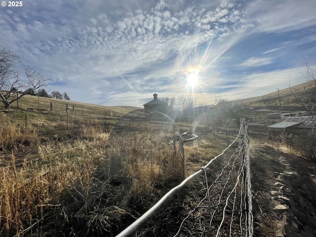 view of yard with a rural view