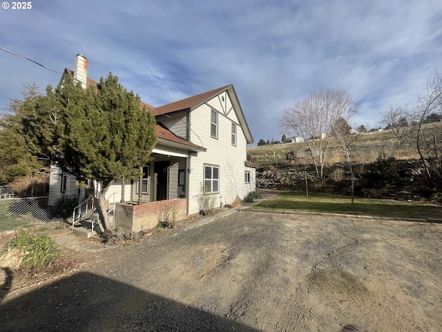 view of home's exterior with covered porch