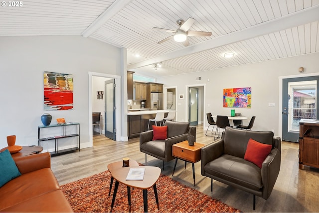 living room with ceiling fan, wooden ceiling, lofted ceiling with beams, and light wood-type flooring