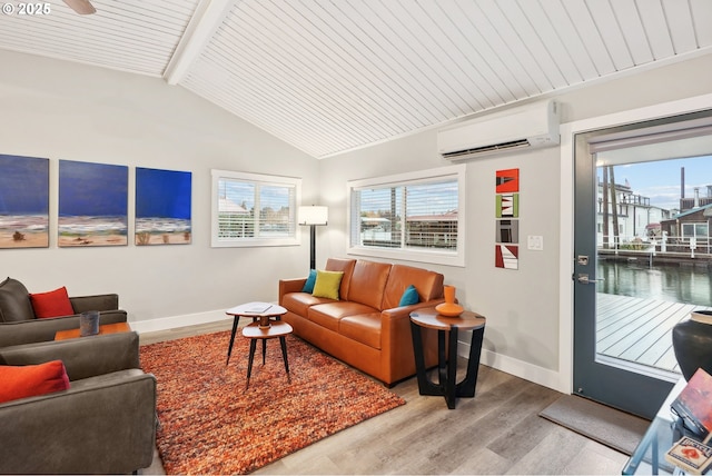 living room with hardwood / wood-style floors, lofted ceiling with beams, wood ceiling, and a wall unit AC