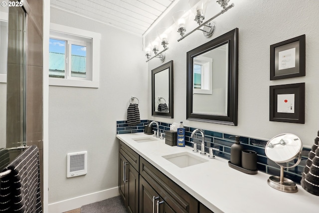 bathroom with decorative backsplash, wood ceiling, and vanity