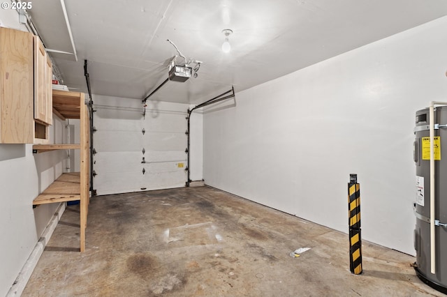 garage featuring strapped water heater and a garage door opener