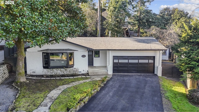 ranch-style home with a garage