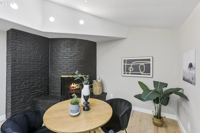 dining space with hardwood / wood-style flooring