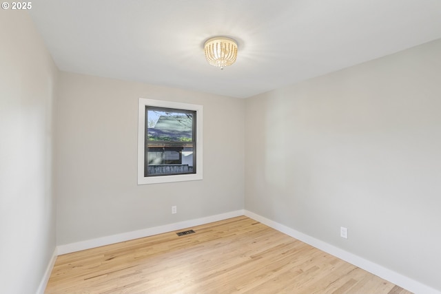 empty room with hardwood / wood-style floors