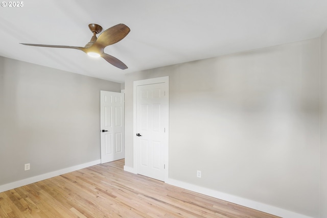 spare room with ceiling fan and light hardwood / wood-style floors