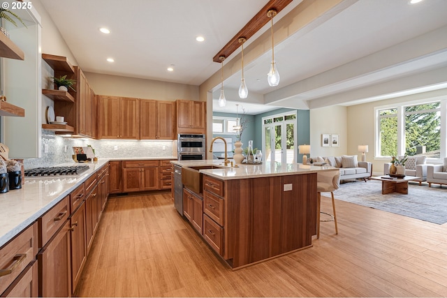 14 Juarez St, Lake Oswego, OR 97035 - kitchen featuring a sink, open shelves, light wood finished floors, stainless steel appliances, and healthy amount of natural light