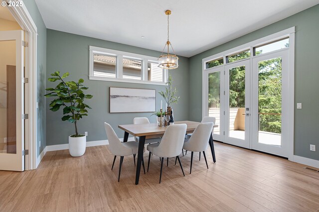 14 Juarez St, Lake Oswego, OR 97035 - dining space featuring light wood-style flooring, baseboards, a chandelier, and french doors
