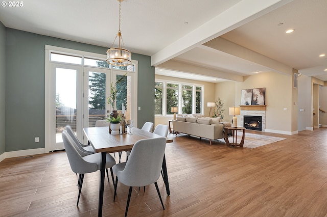 14 Juarez St, Lake Oswego, OR 97035 - dining space featuring a chandelier, recessed lighting, baseboards, light wood finished floors, and a stone fireplace