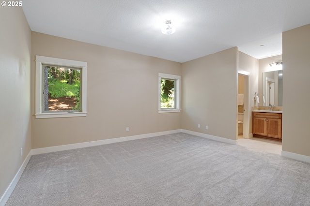 14 Juarez St, Lake Oswego, OR 97035 - unfurnished bedroom with light carpet, a sink, baseboards, and ensuite bathroom