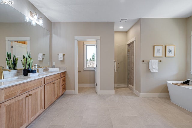 14 Juarez St, Lake Oswego, OR 97035 - full bath with double vanity, a shower stall, a freestanding bath, tile patterned flooring, and baseboards