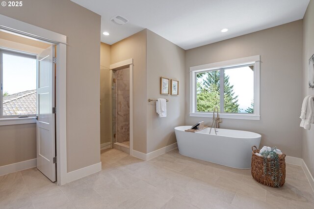 14 Juarez St, Lake Oswego, OR 97035 - bathroom featuring a soaking tub, baseboards, a shower stall, recessed lighting, and tile patterned floors