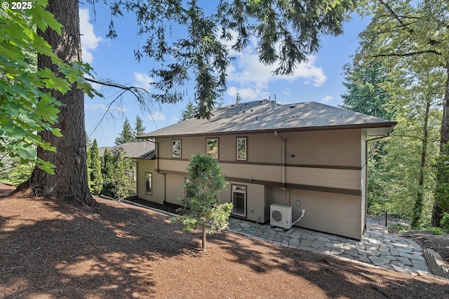 14 Juarez St, Lake Oswego, OR 97035 - back of property featuring a patio, a cooling unit, and a shingled roof