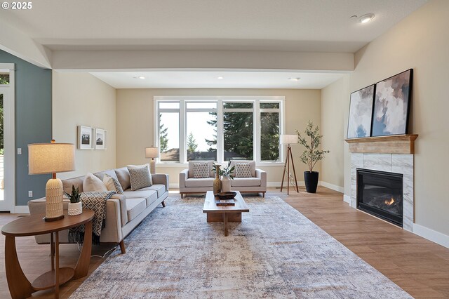 14 Juarez St, Lake Oswego, OR 97035 - living room featuring wood finished floors, a tiled fireplace, baseboards, recessed lighting, and beam ceiling