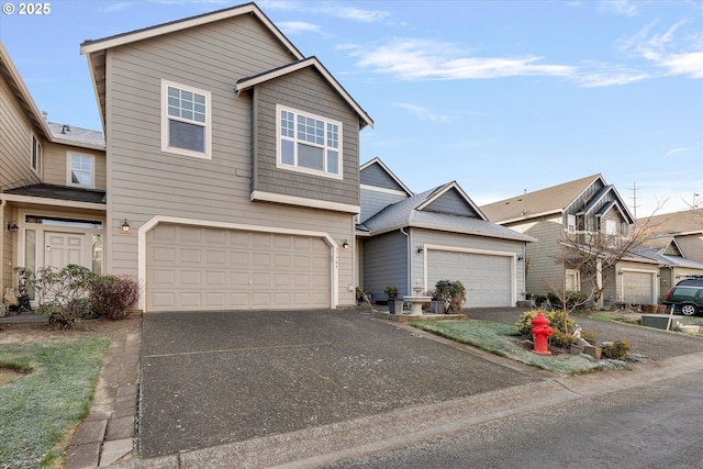 traditional-style house with aphalt driveway and an attached garage