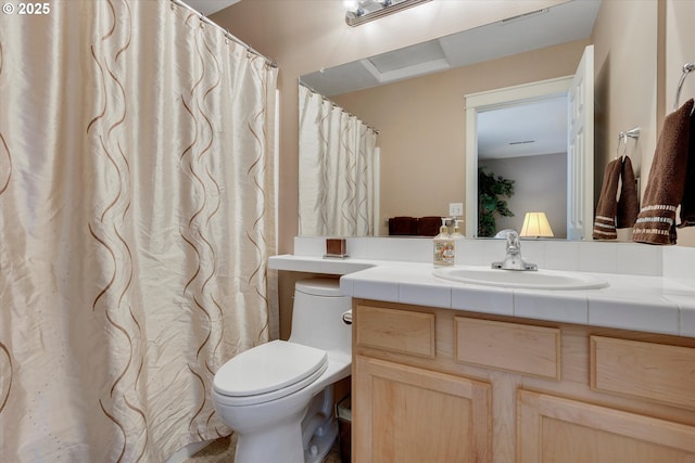 bathroom with toilet and vanity