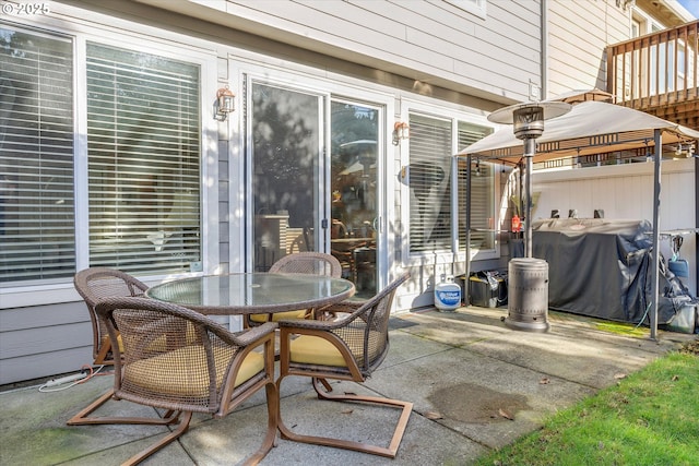 view of patio featuring a grill and outdoor dining area