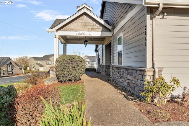 view of side of home with stone siding