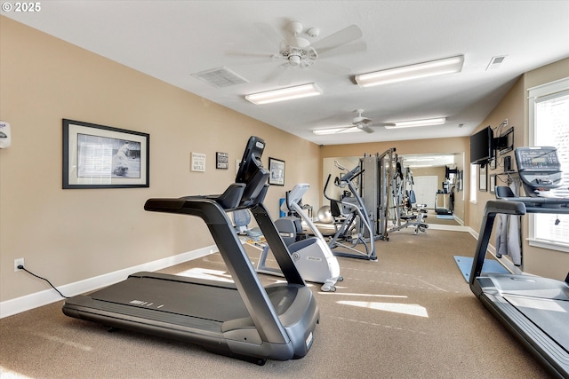 gym with visible vents, baseboards, and ceiling fan