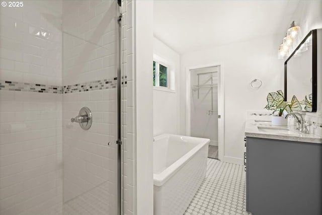 4819 SW Hamilton St, Portland, OR 97221 - full bath featuring a shower stall, double vanity, a soaking tub, and a spacious closet