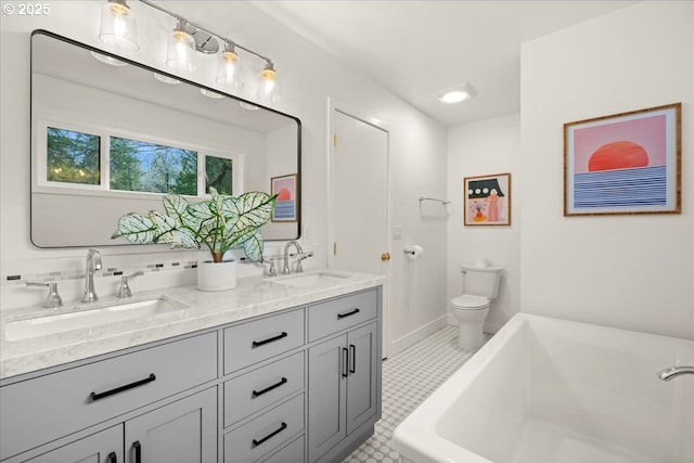 4819 SW Hamilton St, Portland, OR 97221 - full bathroom with a tub, double vanity, toilet, and tile patterned floors