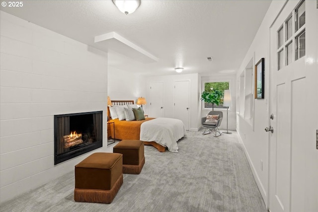 4819 SW Hamilton St, Portland, OR 97221 - bedroom featuring carpet floors, a fireplace, and baseboards