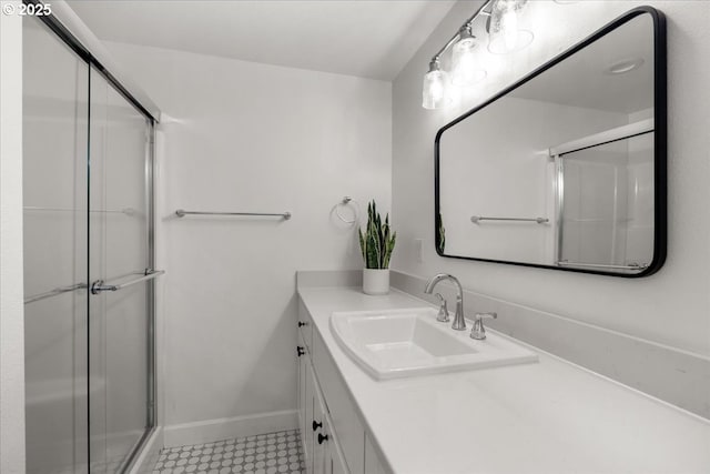 4819 SW Hamilton St, Portland, OR 97221 - bathroom featuring vanity, a shower with shower door, and baseboards