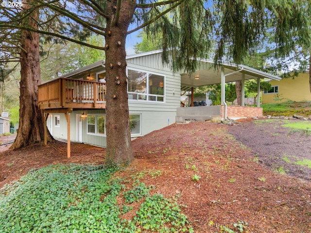 4819 SW Hamilton St, Portland, OR 97221 - view of side of home with a wooden deck