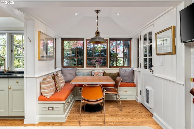 sunroom / solarium with heating unit and a sink