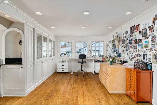 office featuring light wood-style floors, recessed lighting, ornamental molding, and built in desk