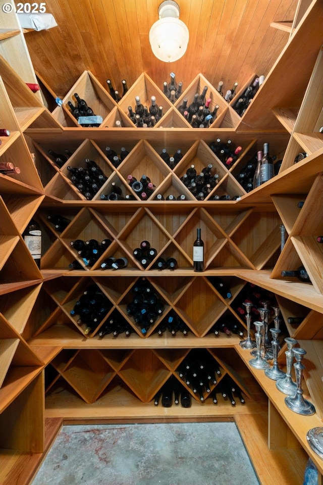 wine cellar with wood finished floors and wood ceiling