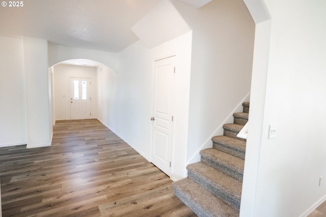 24823 Hawks View Dr, Veneta, OR 97487 - entryway with arched walkways, wood finished floors, and stairs