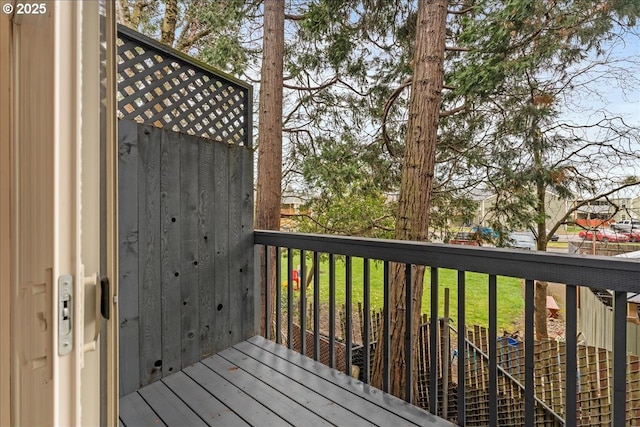 wooden terrace with a lawn